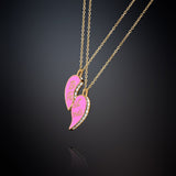 PAIR OF NECKLACES WITH PINK HALF HEART PENDANTS